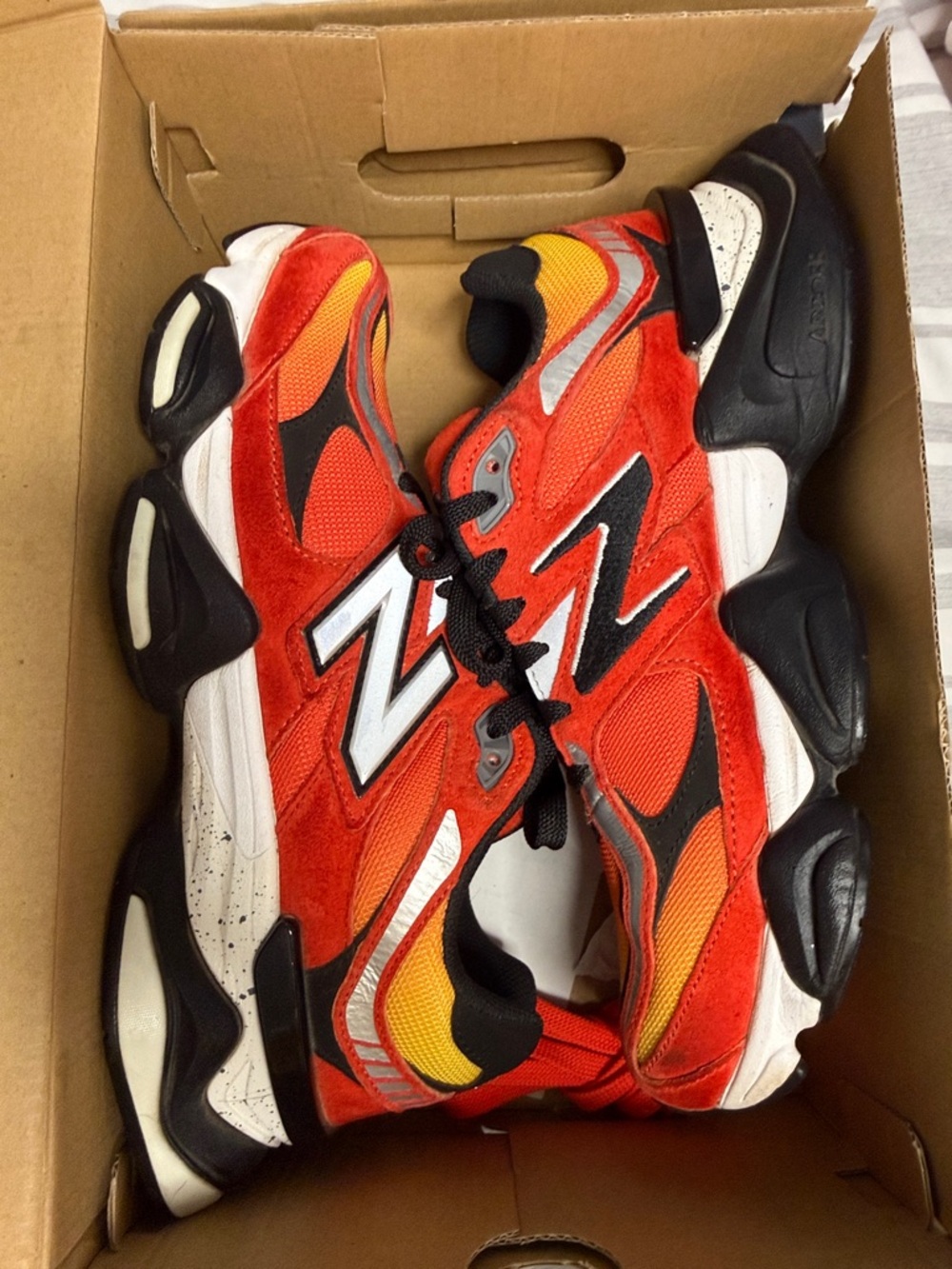 New Balance 9060 Red and Black Sneakers with Yellow Accents